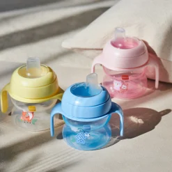 MAM BABY                    Tasse à bec souple silicone avec anses     Panaché            150 Ml